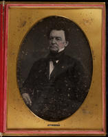 [Three-quarter length portrait of a rather stern looking, unidentified man, wearing a high white collar.]