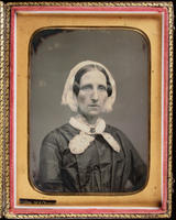 [Portrait of a rather stern, unidentified, older woman wearing a lace collar and cap.]