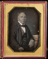 [Portrait of a rather portly, unidentified man with sideburns, resting his left arm on a table.]