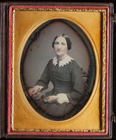 [Portrait of an unidentified woman sitting demurely with her left hand in her lap.]