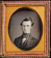 [Portrait of an unidentified man with a long, narrow face, wearing a high white collar and a wide black tie. ]