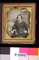 [Portrait of an unidentified young woman holding a daguerreotype.]
