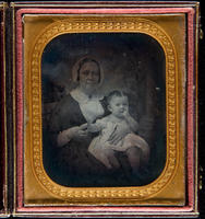 [Julianna Randolph Wood holding her baby son Stuart.]