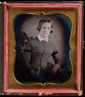 [Seated portrait of an unidentified woman looking slightly to her right and wearing a small white collar.]