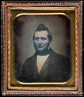 [Portrait of an unidentified man with sideburns and short beard.]