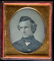 [Portrait of an unidentified man, head slightly lowered, looking toward his right.]