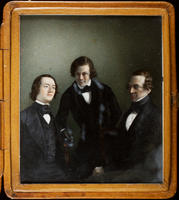 [Portrait of three unidentified men, possibly a family group, in formal clothes.]