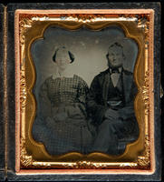 [Portrait of an unidentified couple sitting side by side.]