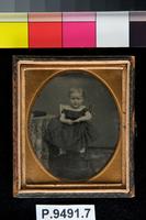 [Portrait of an unidentified little girl sitting on a high chair.]
