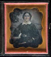[Portrait of an unidentified older woman, hair parted in the middle, wearing eye glasses.]
