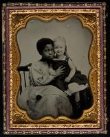 [Young African American nursemaid with her young white charge]