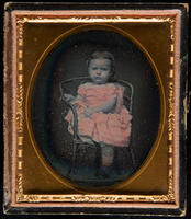 [Portrait of an unidentified girl sitting on a chair.]