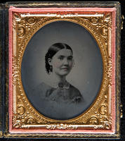 [Portrait of an unidentified woman, hair parted severly in the middle, wearing a brooch.]
